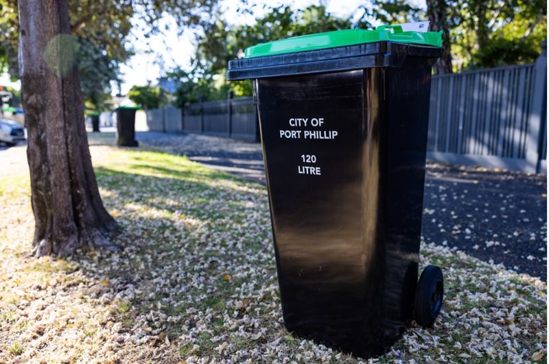 green waste bin awaiting collection on kerbside